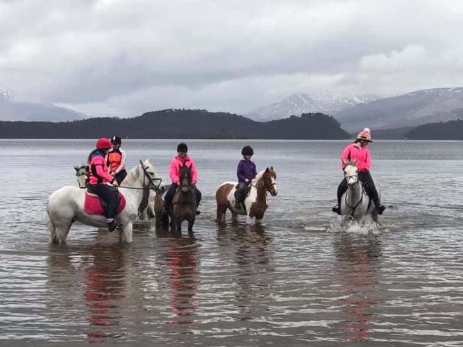 Horse riders from Tullochan stables in Loch Lomond